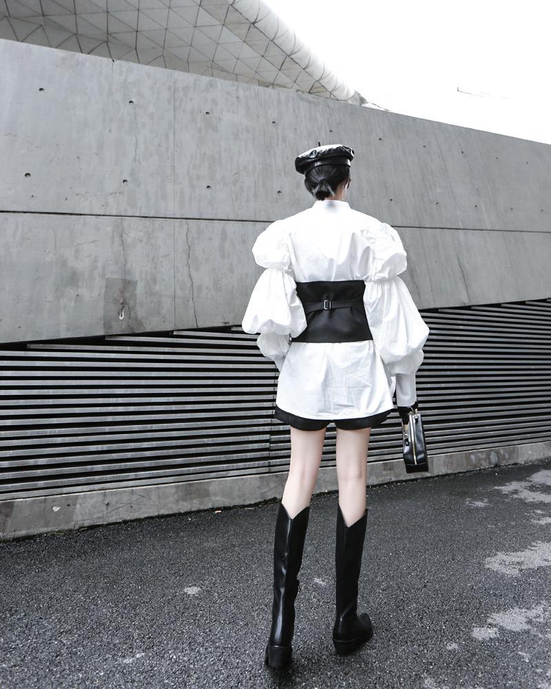 Woman wearing white Daoko Pleated Puff Long Sleeve Shirt with dramatic volume sleeves.