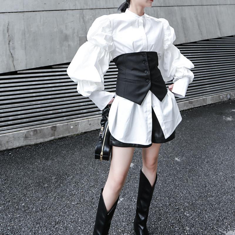 Woman wearing white Daoko Pleated Puff Long Sleeve Shirt with dramatic volume sleeves.