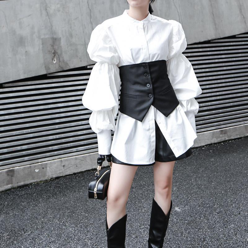 Woman wearing white Daoko Pleated Puff Long Sleeve Shirt with dramatic volume sleeves.