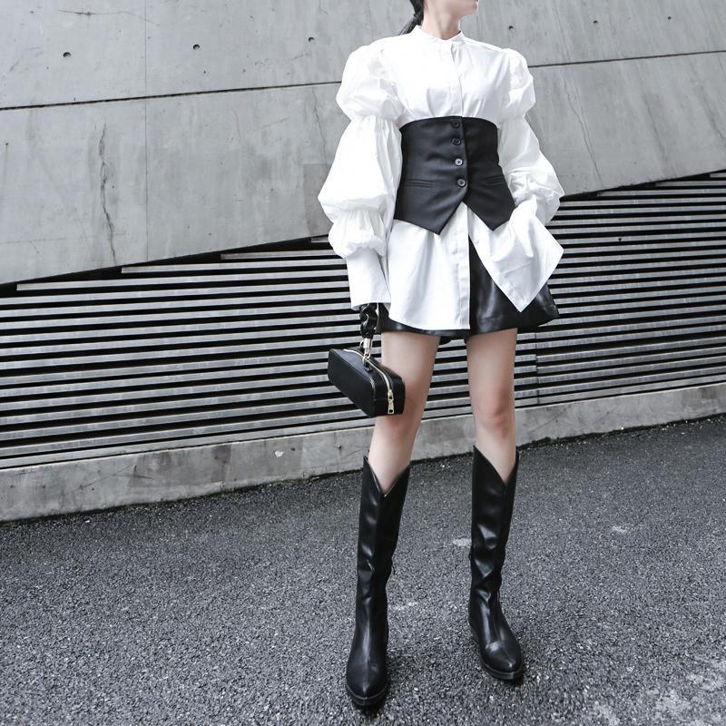 Woman wearing white Daoko Pleated Puff Long Sleeve Shirt with dramatic volume sleeves.