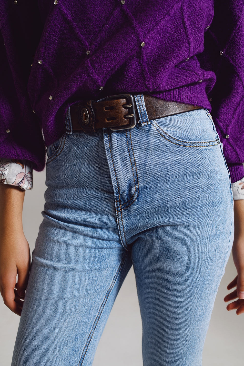 Elevate your everyday style with our Straight Leg Jeans With Distressed Hem in Light Blue.