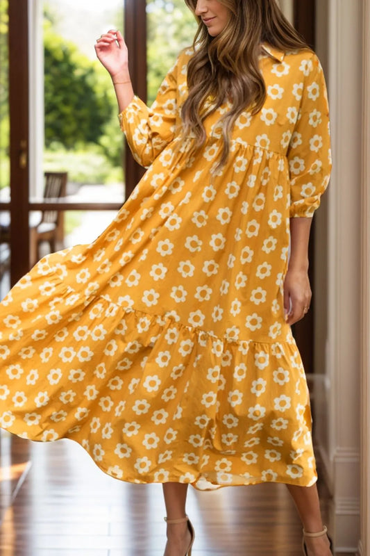 This charming yellow floral dress features a classic collar neckline and comfortable three-quarter sleeves.