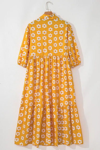 This charming yellow floral dress features a classic collar neckline and comfortable three-quarter sleeves.