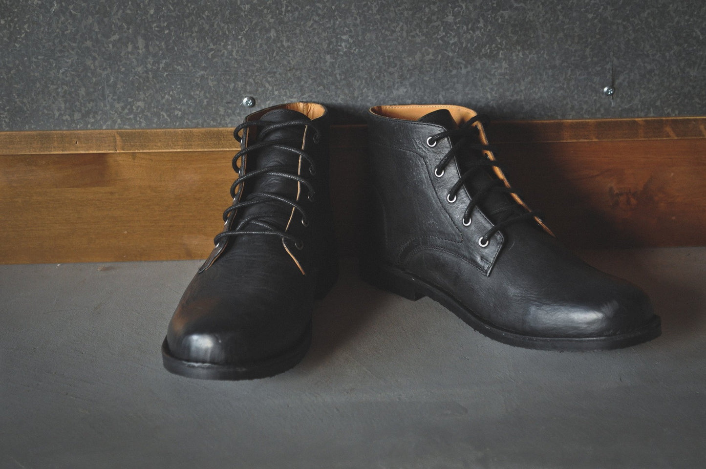 Experience timeless versatility with The Grover in classic black buffalo leather.