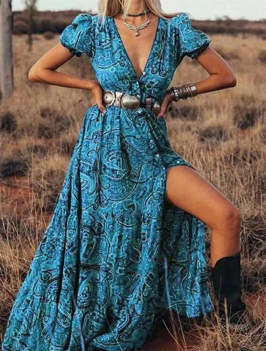 Embrace bohemian elegance with this stunning red maxi dress featuring a bold paisley print.