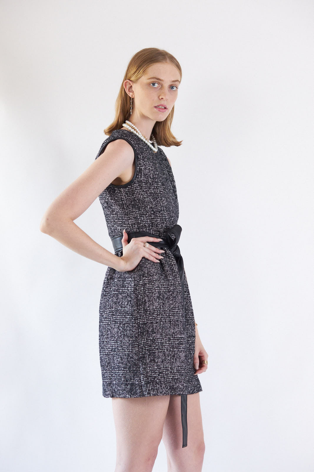 Command attention in the Boss Woman Tweed Dress���a sophisticated mini dress tailored for the bold and confident.