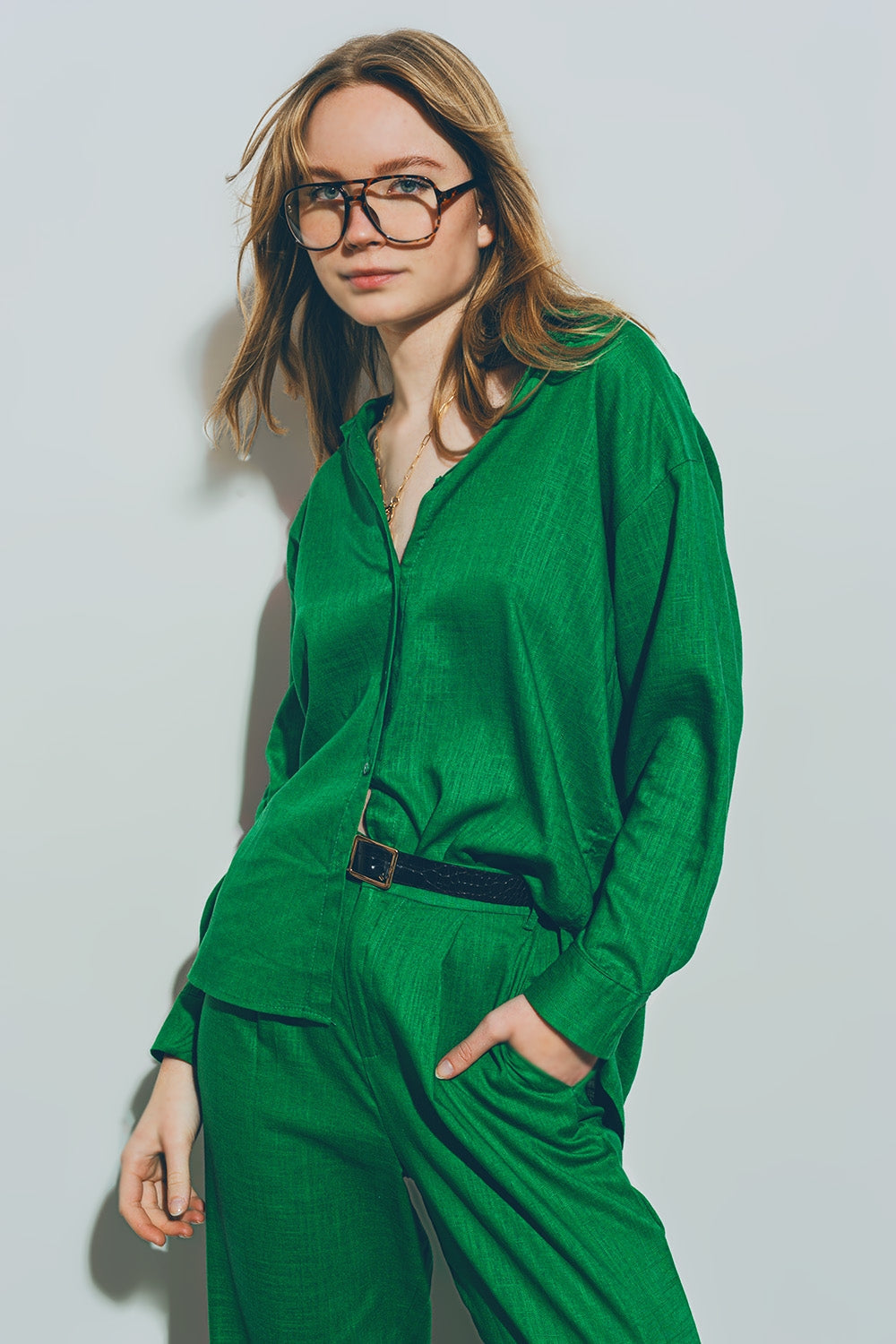 Woman wearing green cotton loose fit shirt with matching pants