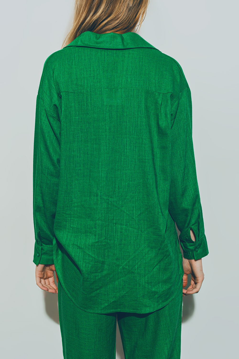 Woman wearing green cotton loose fit shirt with matching pants