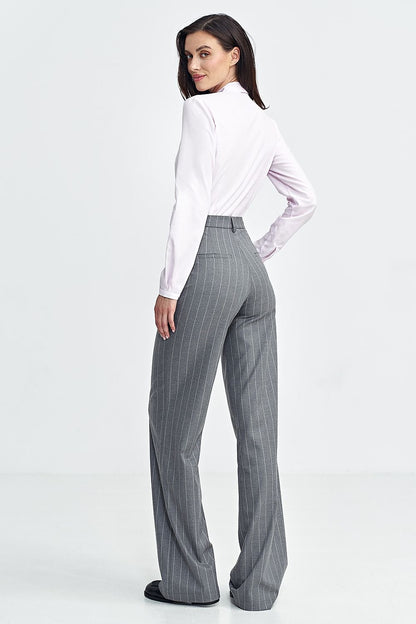 Step into timeless sophistication with Nife���s Model 199716 trousers.