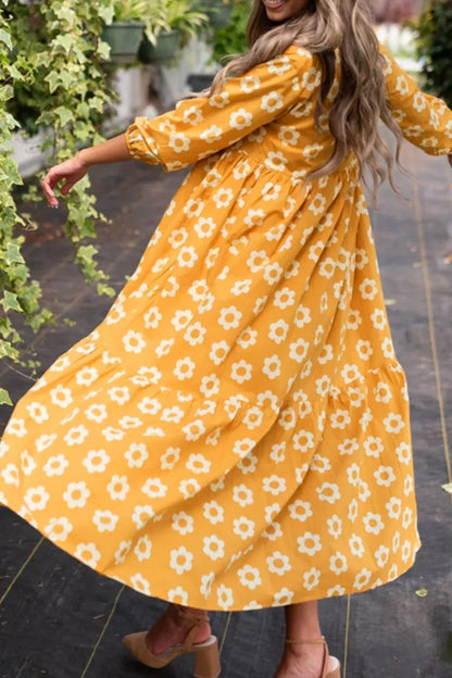 This charming yellow floral dress features a classic collar neckline and comfortable three-quarter sleeves.
