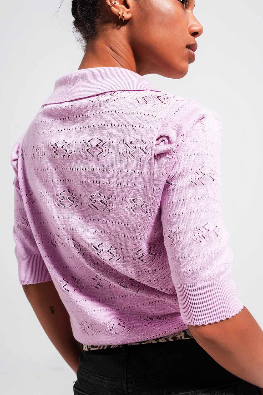 Add a touch of feminine charm to your wardrobe with our Pink Pointelle Knit Sweater.
