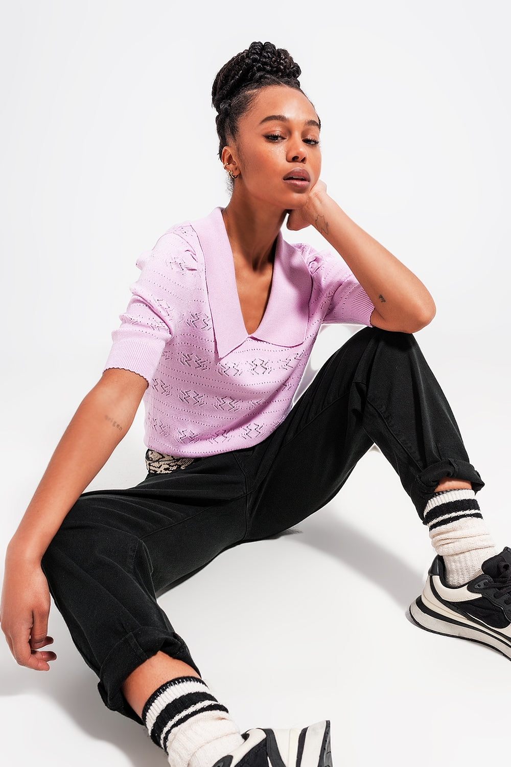 Add a touch of feminine charm to your wardrobe with our Pink Pointelle Knit Sweater.
