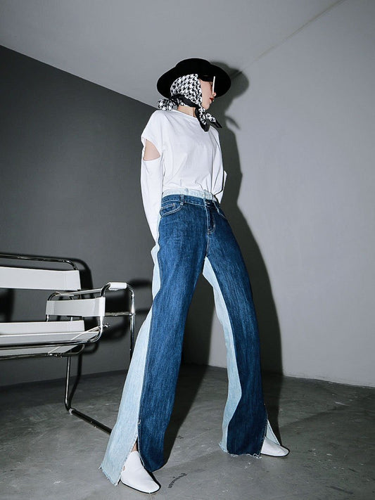 Woman wearing blue Sawako Loose Denim Wide Leg Pants with distinctive side split.