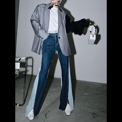 Woman wearing blue Sawako Loose Denim Wide Leg Pants with distinctive side split.