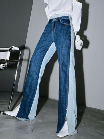 Woman wearing blue Sawako Loose Denim Wide Leg Pants with distinctive side split.