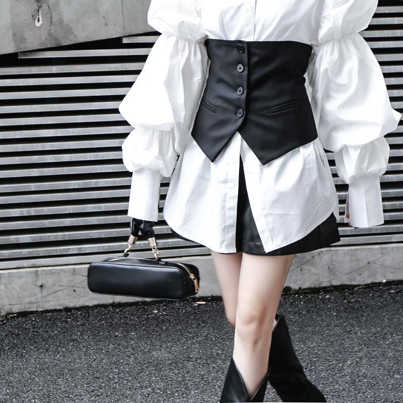 Woman wearing white Daoko Pleated Puff Long Sleeve Shirt with dramatic volume sleeves.