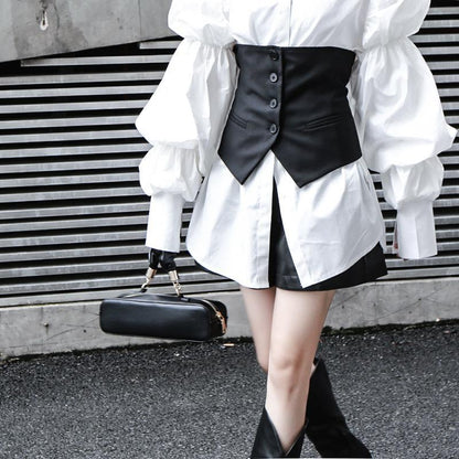 Woman wearing white Daoko Pleated Puff Long Sleeve Shirt with dramatic volume sleeves.