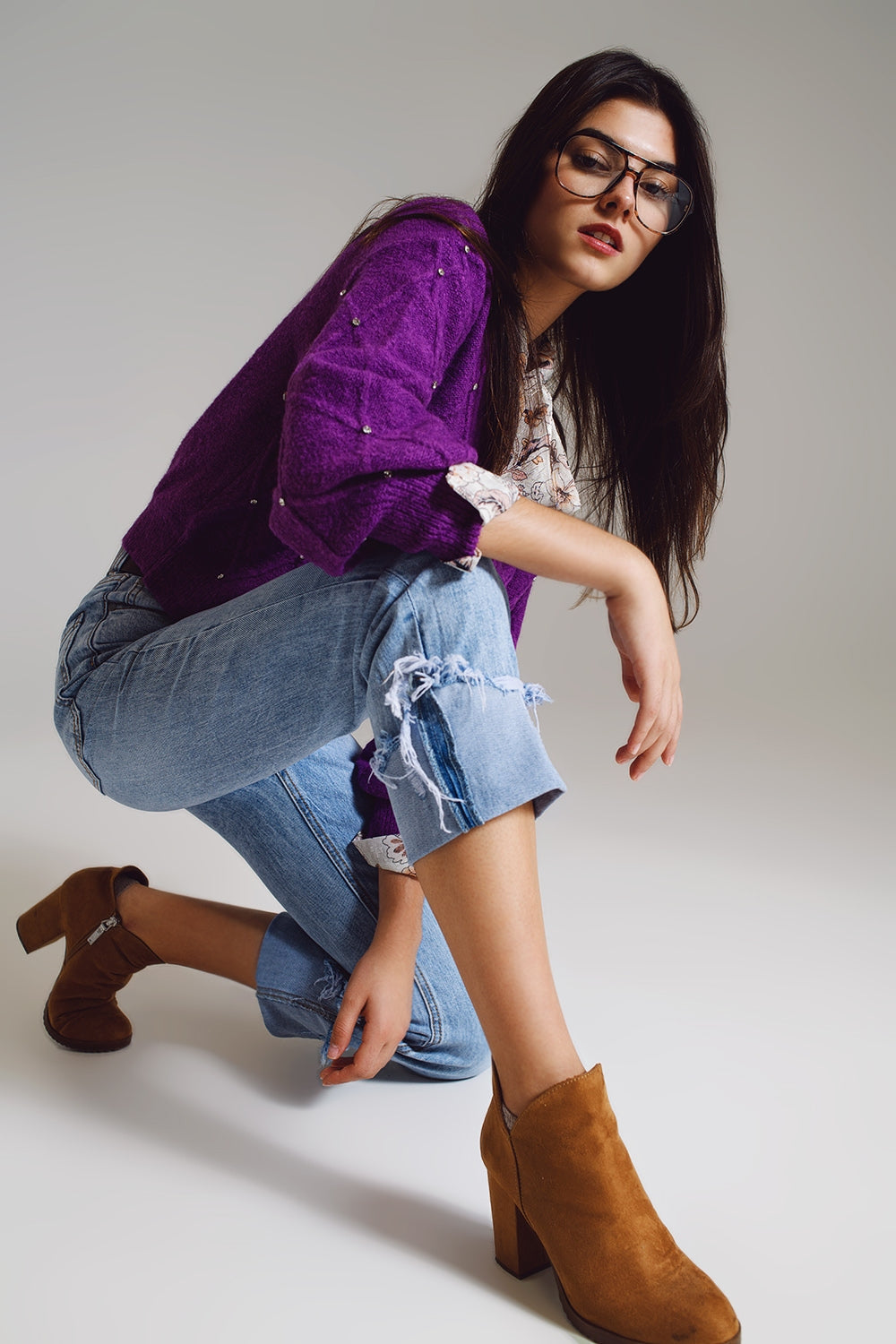 Elevate your everyday style with our Straight Leg Jeans With Distressed Hem in Light Blue.